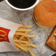 Overhead view of McDonald's fries, burger, apple pie, and coffee